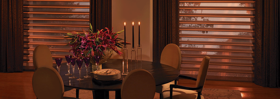 glowing bronze dining room with pirouette shades on tall windows in Cleveland OH home