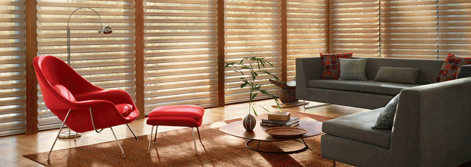 living room with wall to wall windows covered with beige pirouette window shades in Rocky River OH