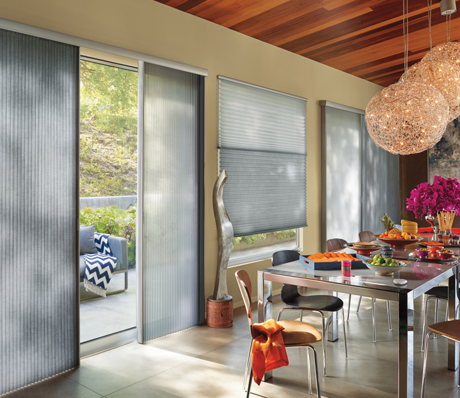 boho dining room with hunter douglas vertical insulating shades Rocky River