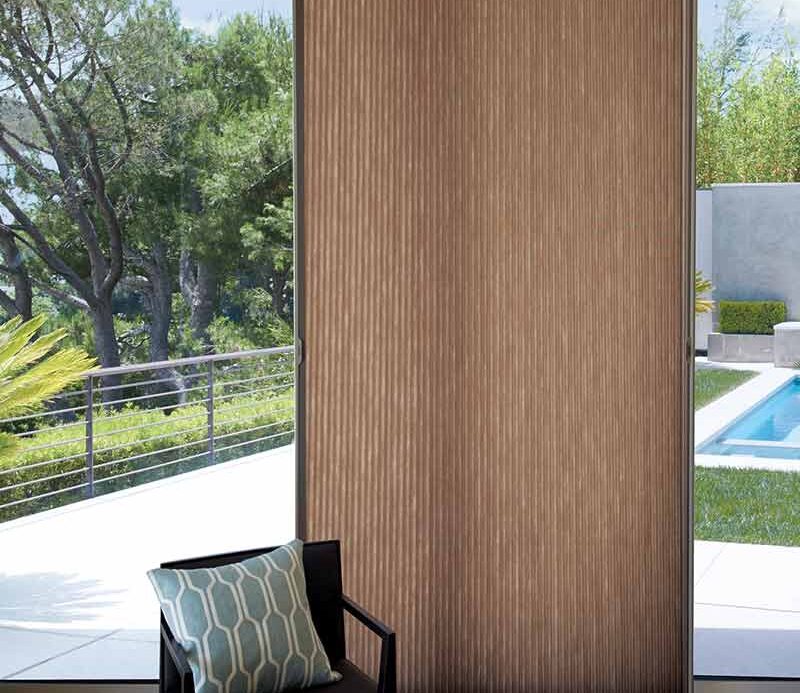 glass patio door with brown honeycomb shades with smart shade technology Chagrin Falls