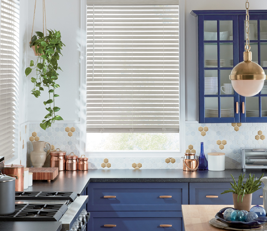blue kitchen with copper detail and hunter douglas faux wood blinds Rocky River