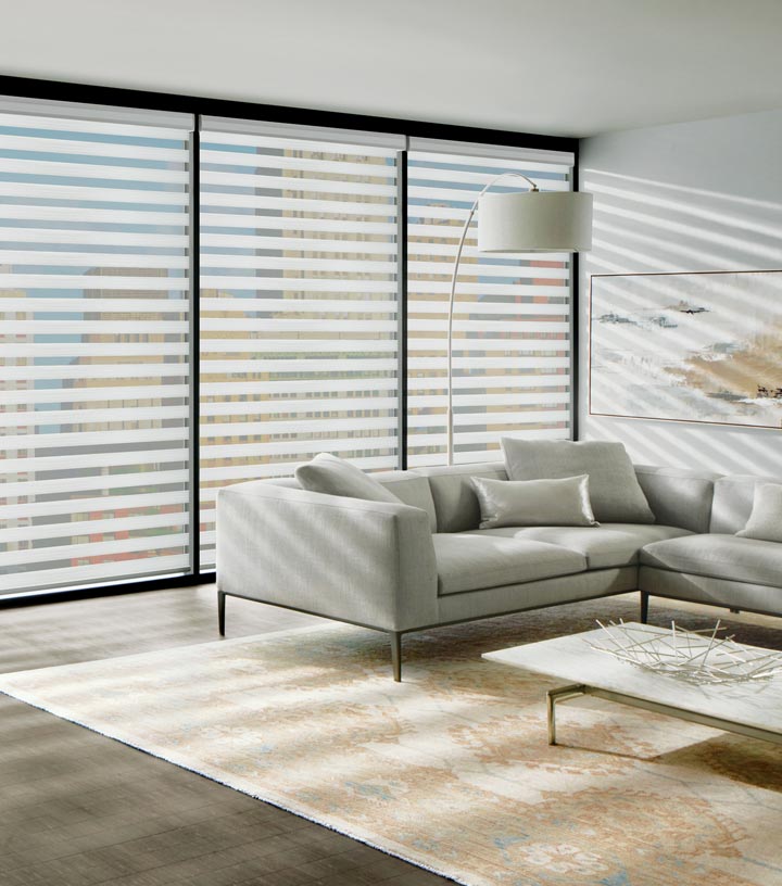 window treatments for large windows designer banded shades on wall of windows with black window trim in Cleveland OH