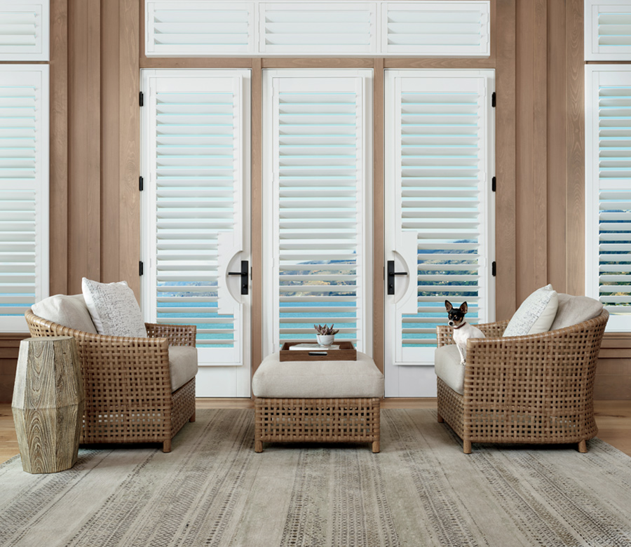 coastal living room with white hunter douglas palm beach polysatin shutters Rocky River Oh
