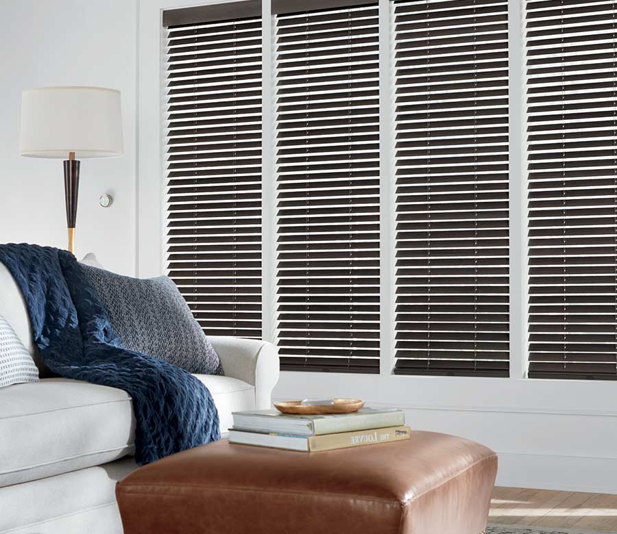 white living room with brown wood blinds