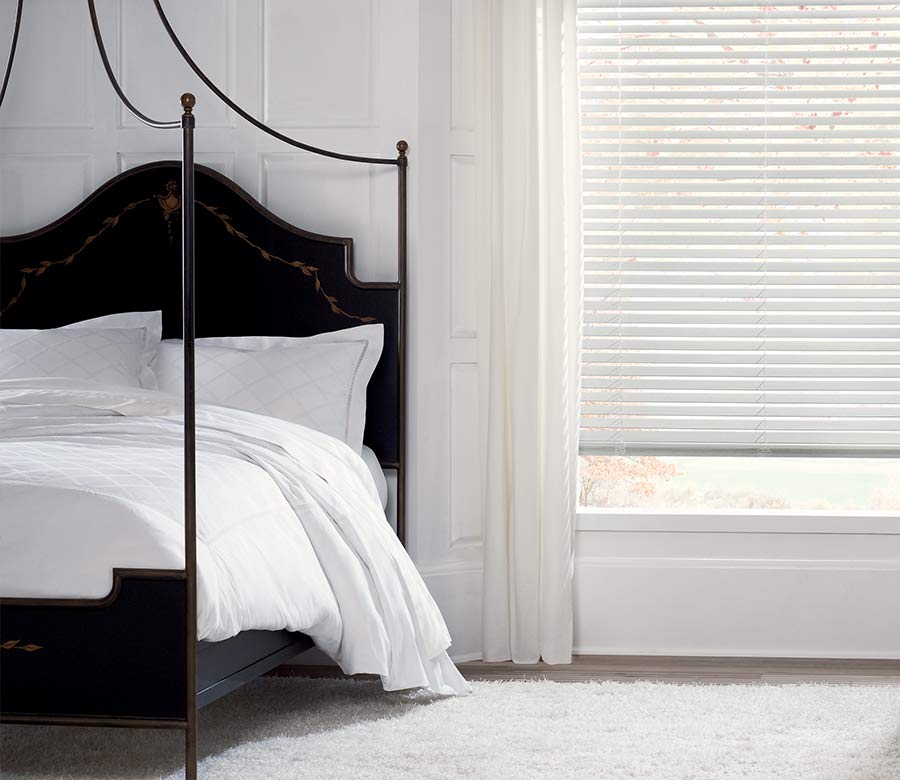 minimal master bedroom with white parkland wood blinds