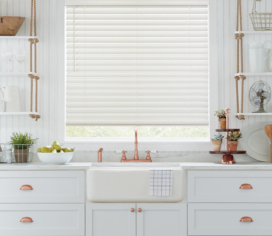 white kitchen with copper detail and white wood blinds hunter douglas Cleveland