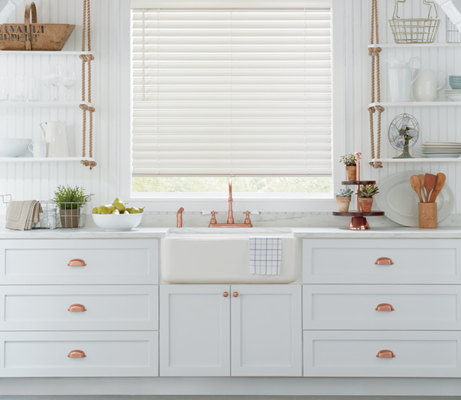 white kitchen with copper detail and white wood blinds hunter douglas Cleveland