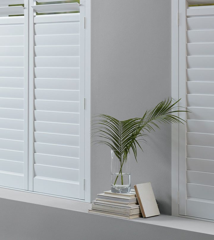 insulating window treatments with plantation shutters in Cleveland living room