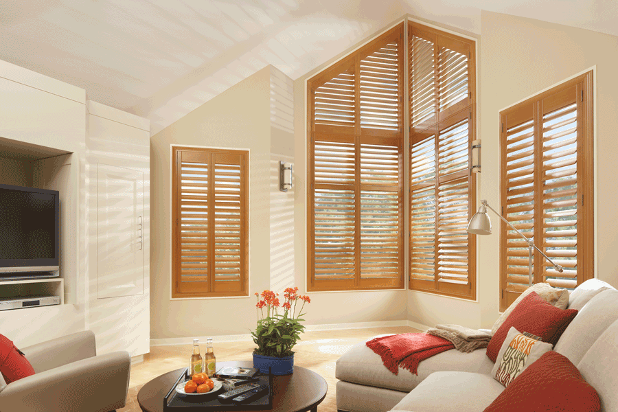 medium wood tone interior shutters for angled windows Hunter Douglas Rocky River 44116