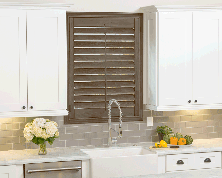 Farmhouse plantation shutters in Cleveland kitchen.