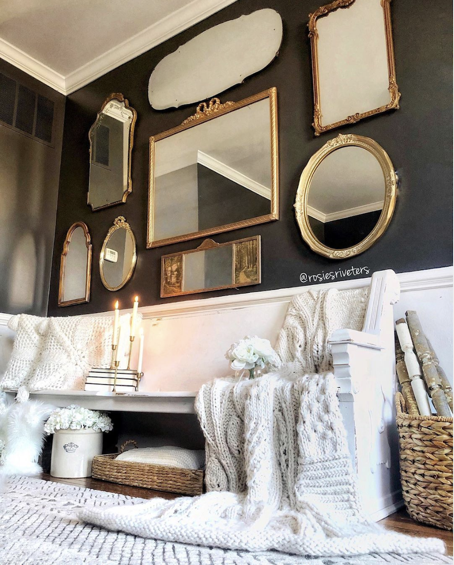 wall of gold framed mirrors 