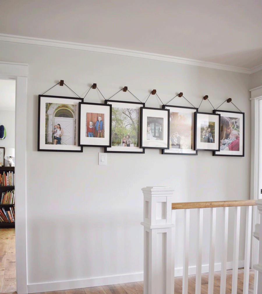 white hallway frames feature wall