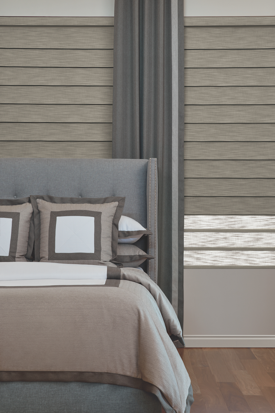 Master bedroom featuring Duolite® vignette roman shades