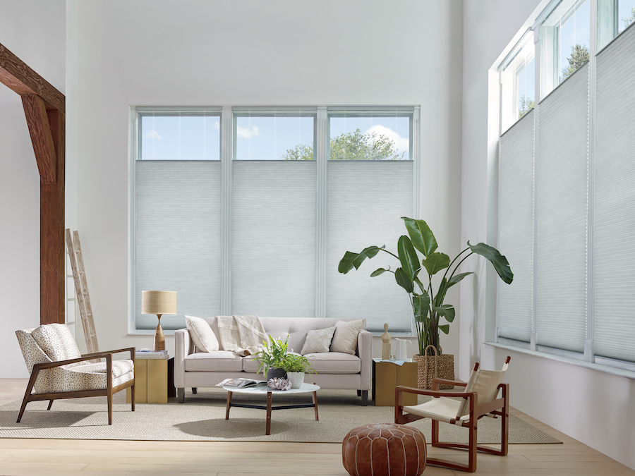 Living room with cellular shades.