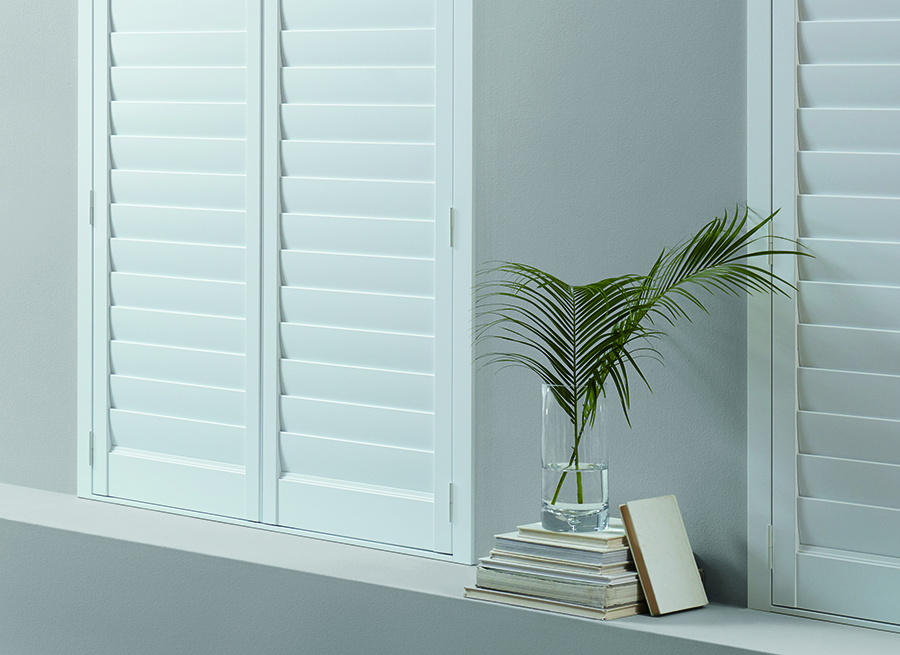 white shutters closed for room darkening details in Cleveland OH home