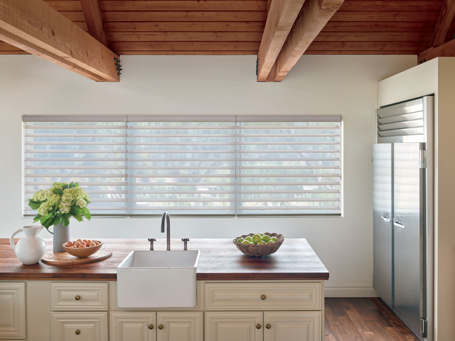 kitchen window with multiple shades and wand motorized system in Akron, OH