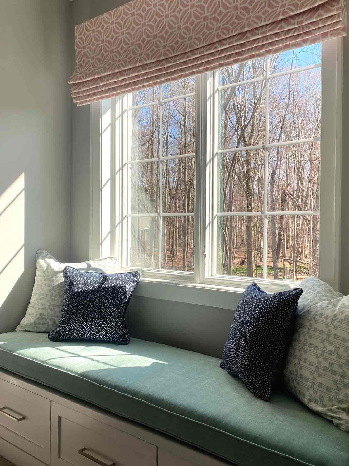 custom pink printed roman shades over window nook in Cleveland, OH
