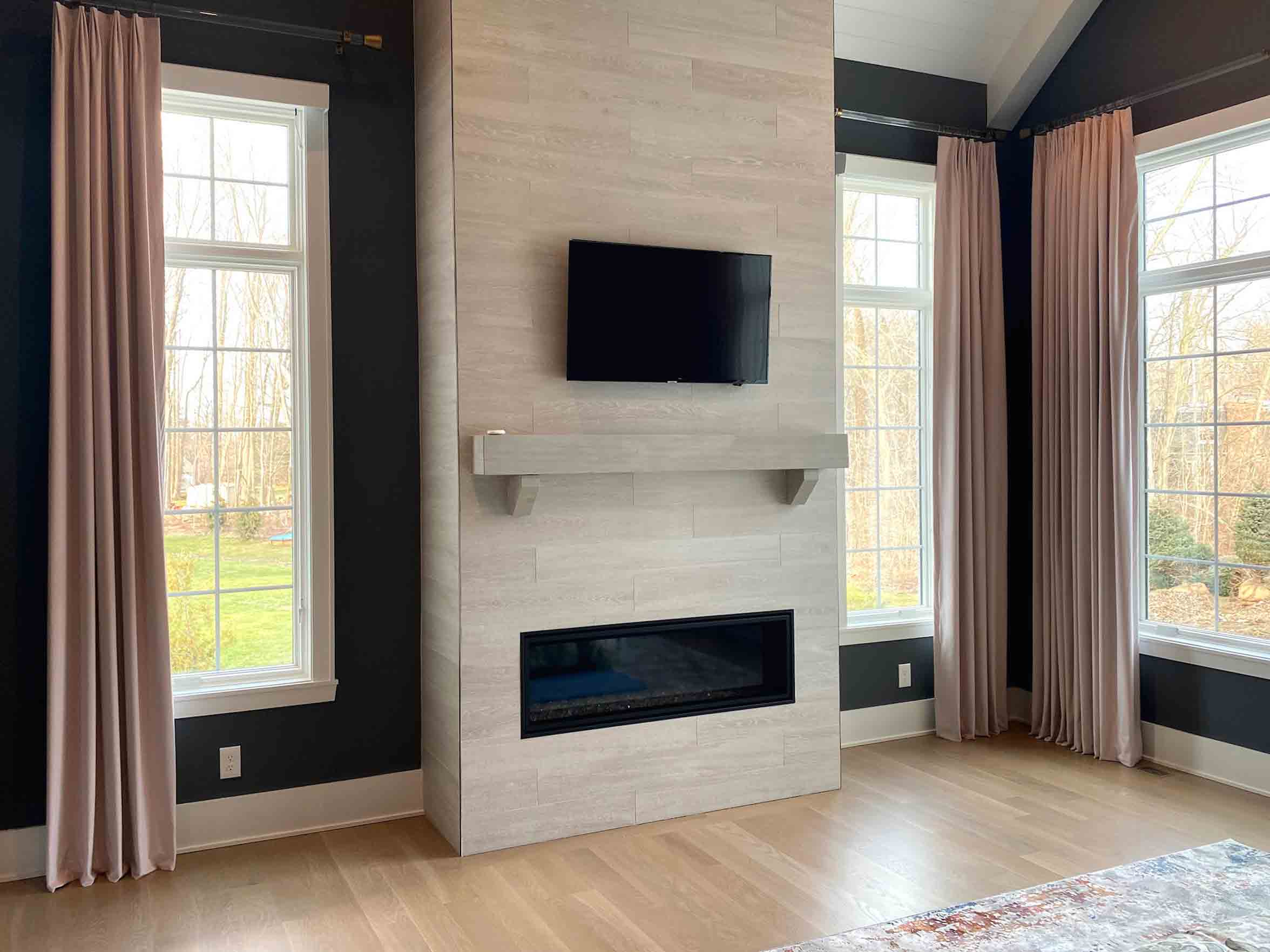 rose drapery over large windows in living room with fireplace Akron, OH