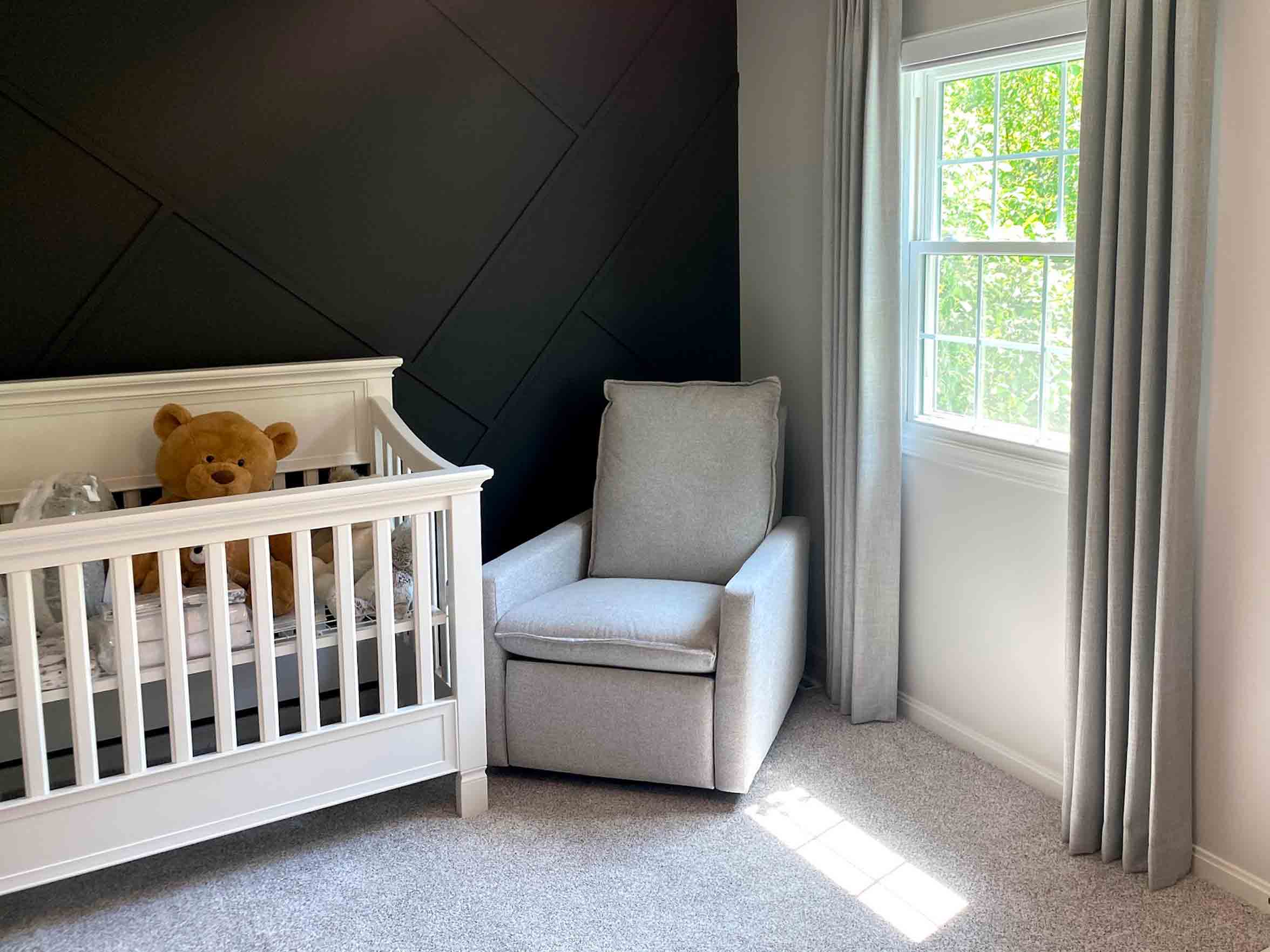 gender neutral nursery with black accent wall and gray custom drapery in Cleveland, OH
