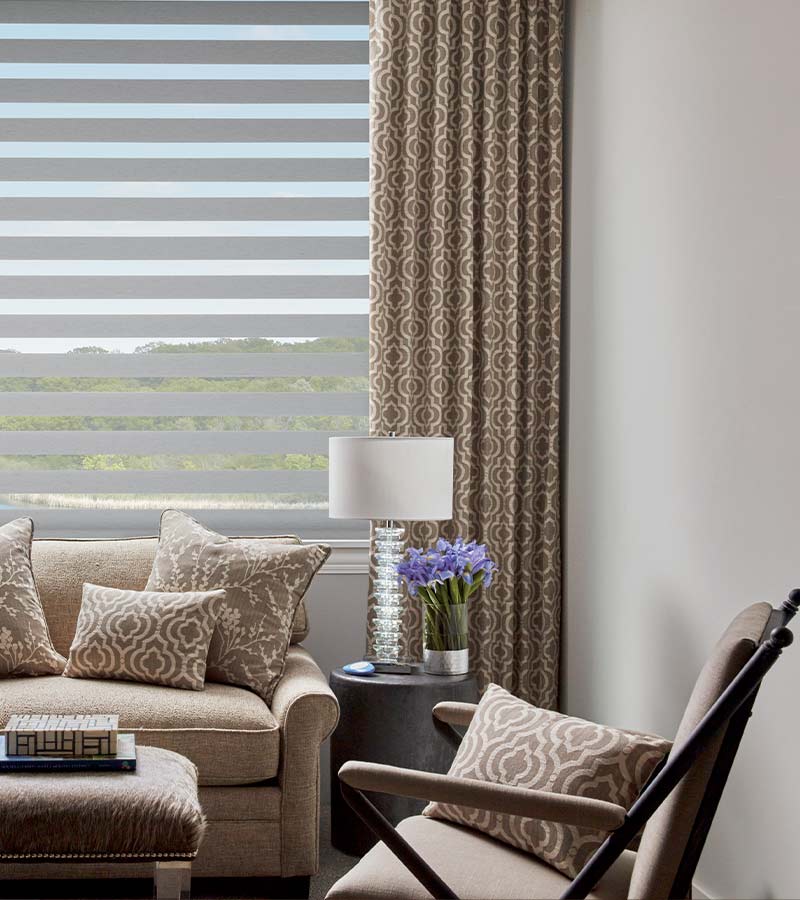 floor to ceiling drapery and gray designer window shades in Cleveland, OH