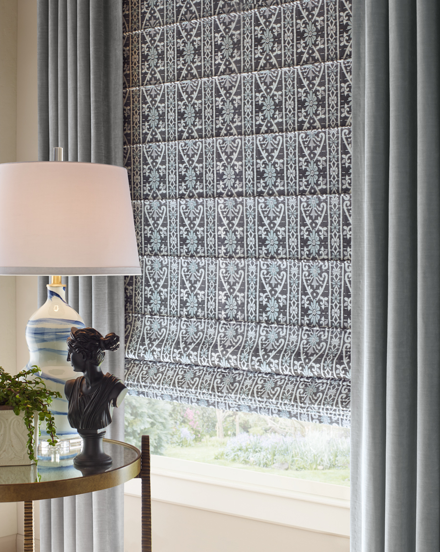 patterned black and white roman shades with side draperies