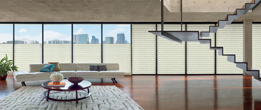 roman shades in Cleveland condo with floor to ceiling windows covered with roman shades in the top down position