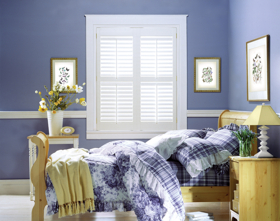 white shutters in bedroom with periwinkle walls in Rocky River OH