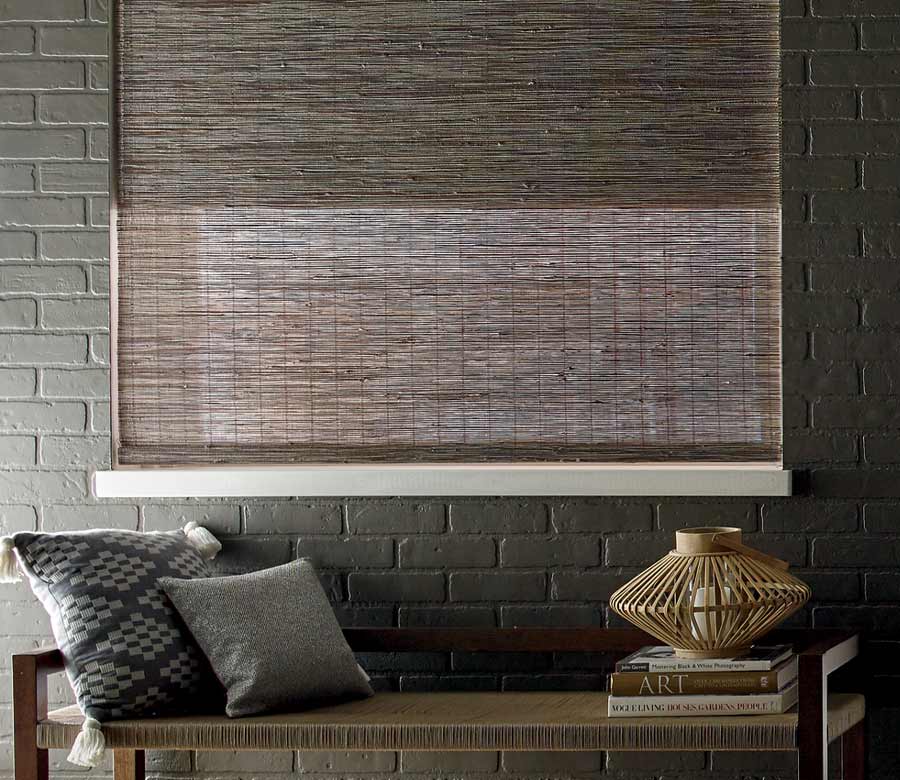 exposed brick wall painted black with coordinating dark brown window treatments in Chagrin Falls, OH