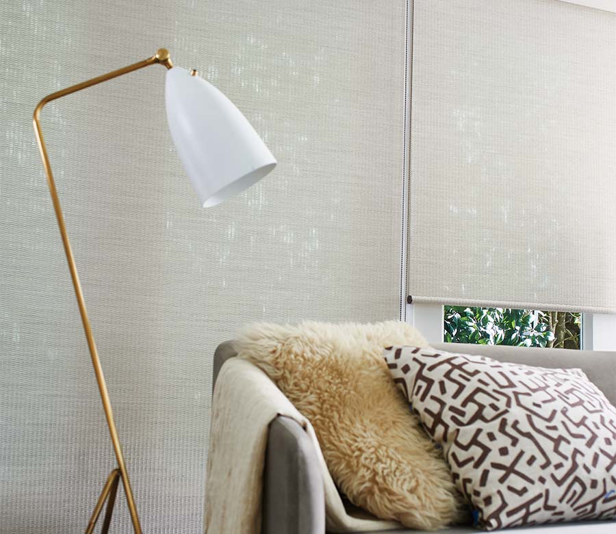 Modern living room with alsutra fabric eggshell color roller shades in Rocky River, OH