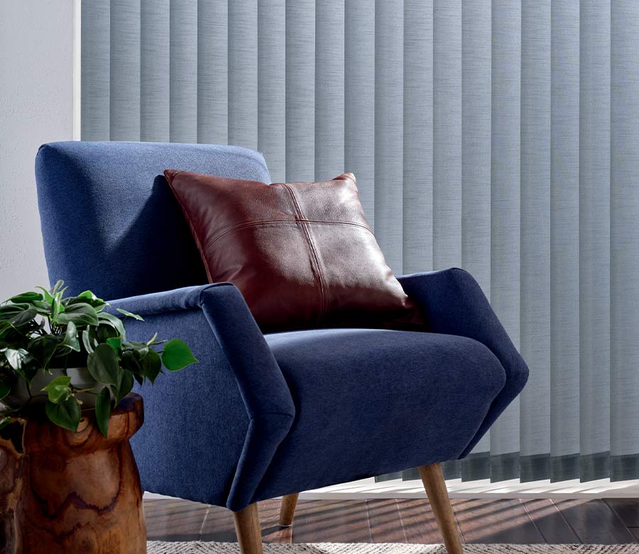 blue arm chair in front of blue window shadings in Cleveland, OH
