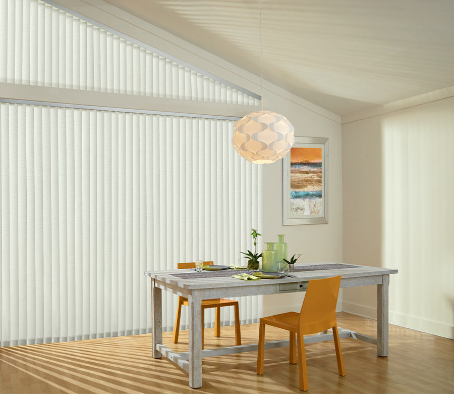 angled window with interior vertical shadings next to modern farmhouse dining room table Akron, OH