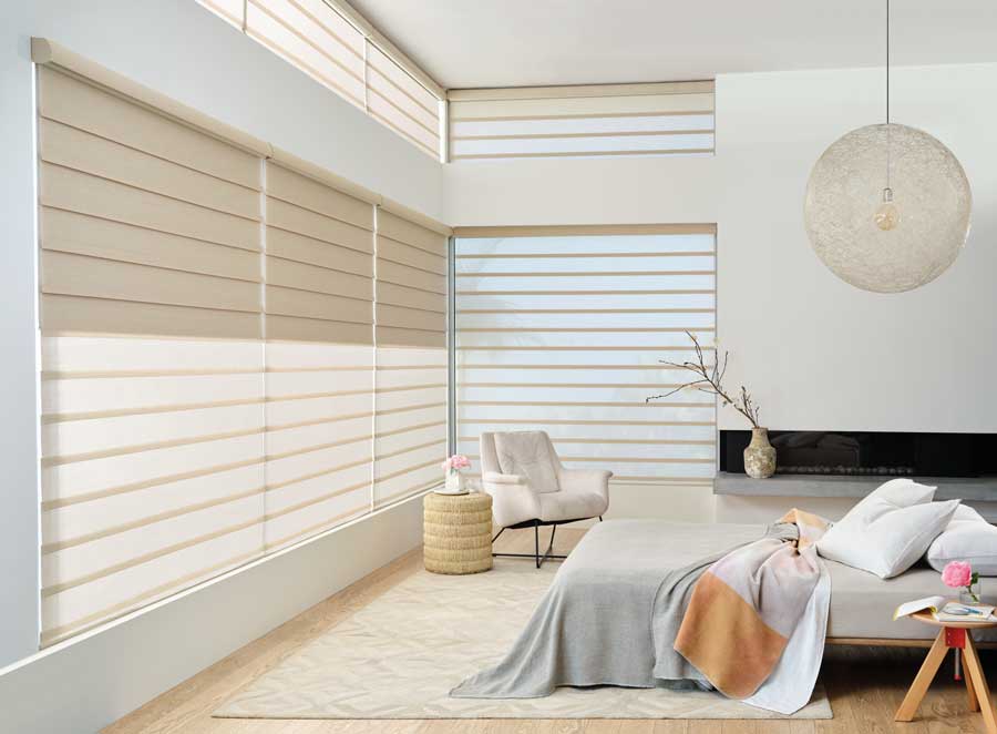 Dual vignette roman shades in airy bedroom