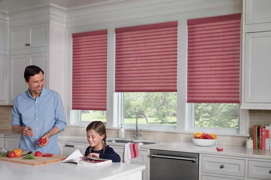 Pink cellular roman shades in kitchen