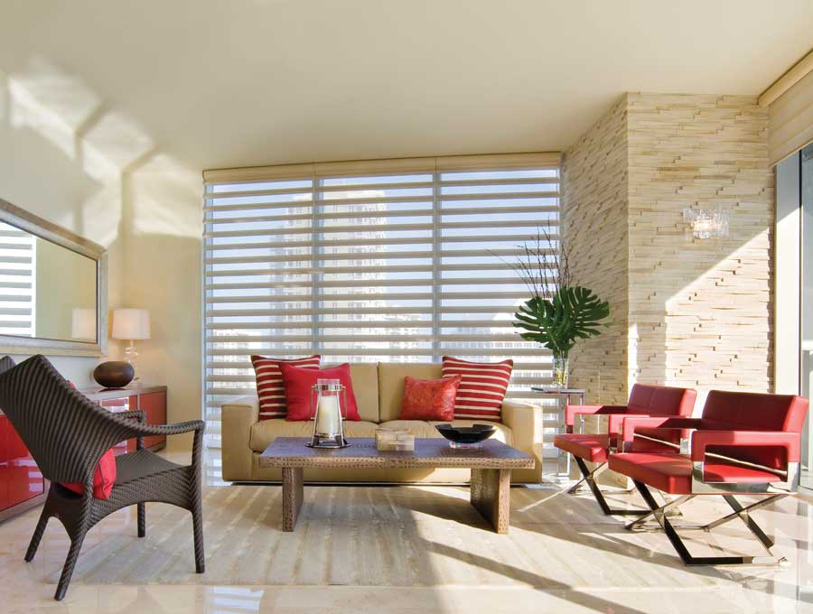 Pirouette shades and red accents living room