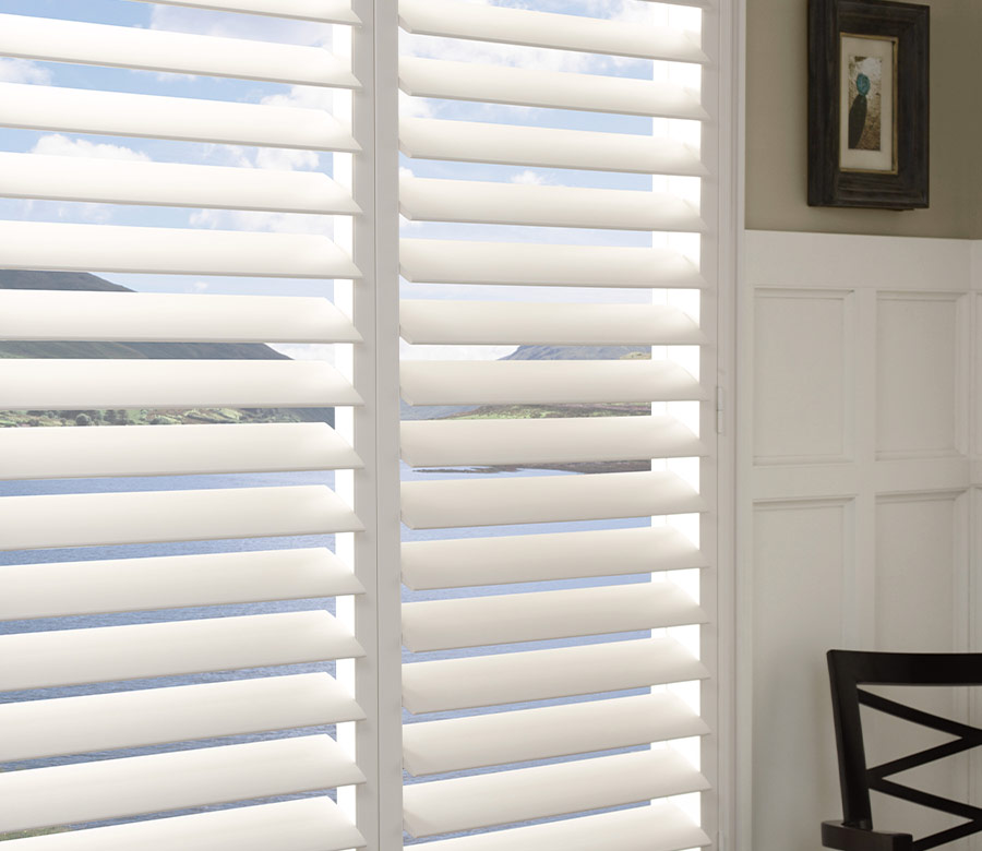 white traditional shutters for kitchen overlooking lake