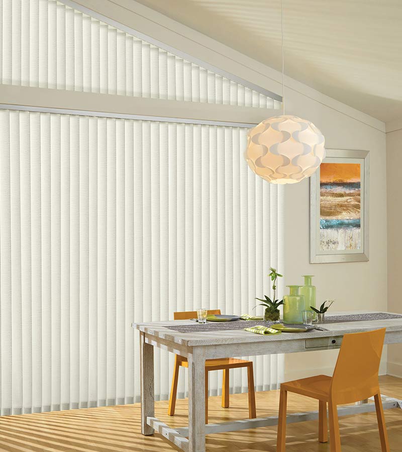dining room large angled windows and sheer vertical blinds in Auburn OH home