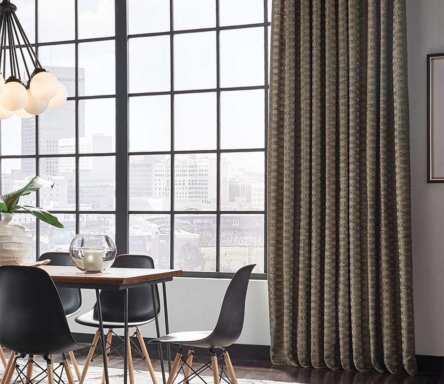 custom window treatments as dark olive drapery in modern loft apartment dining room in Westlake OH home