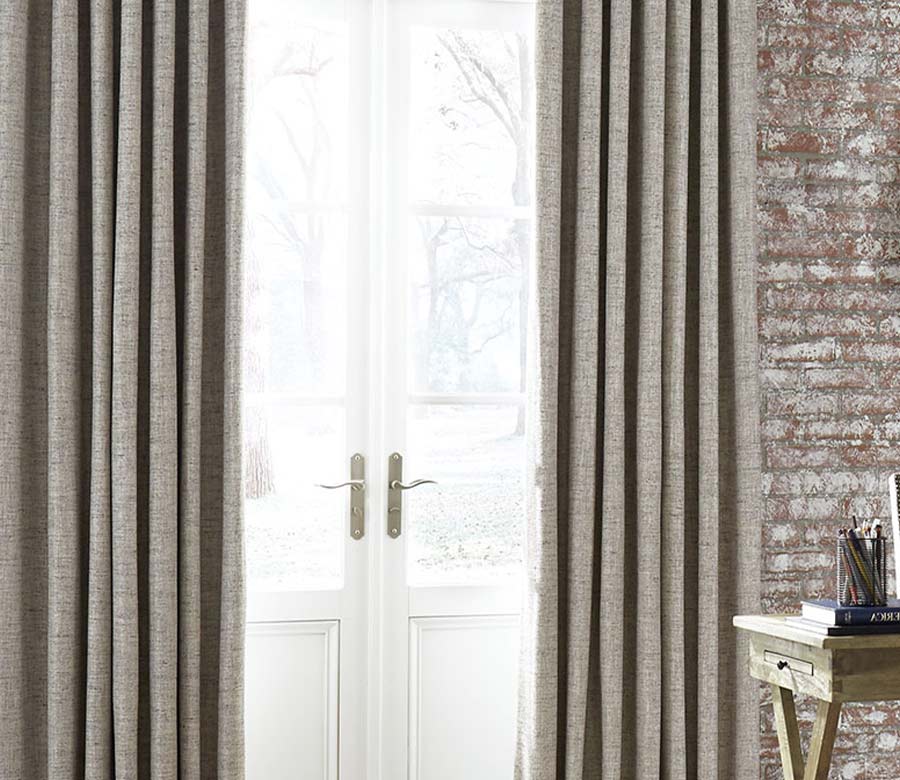 exposed brick room beige draperies and french doors to outside of Solon OH home