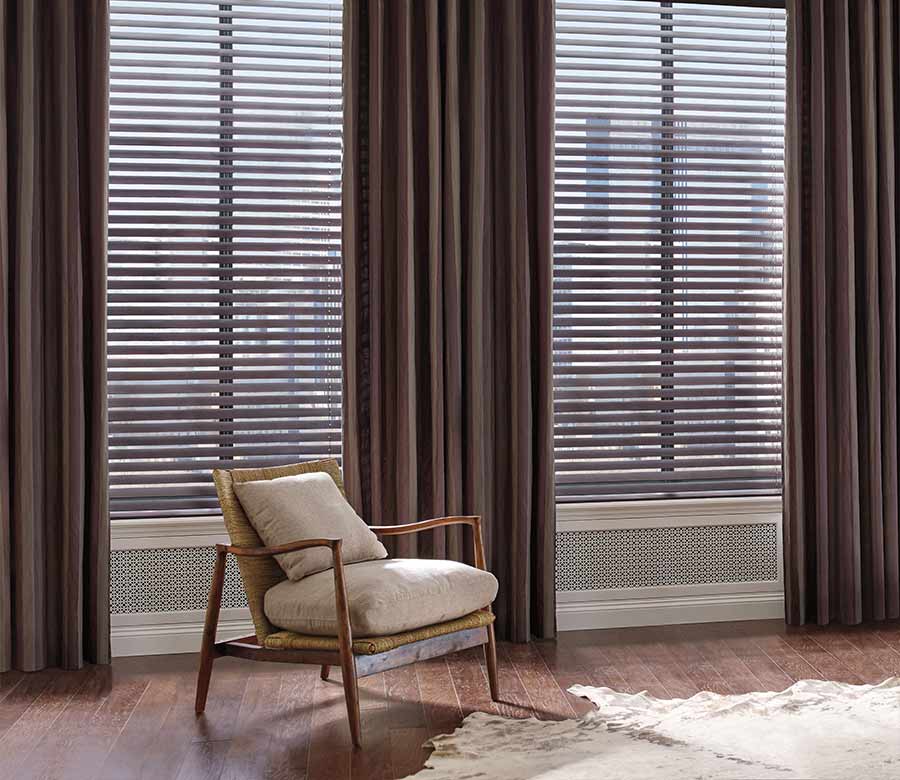 mahogany color blinds framed by dark brown drapery in Solon OH home