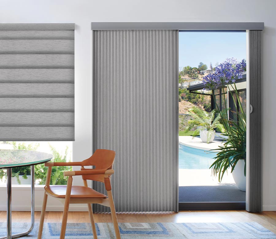 glass patio door leading to pool area covered by vertical cellular shades in gray fabric in Rocky River OH
