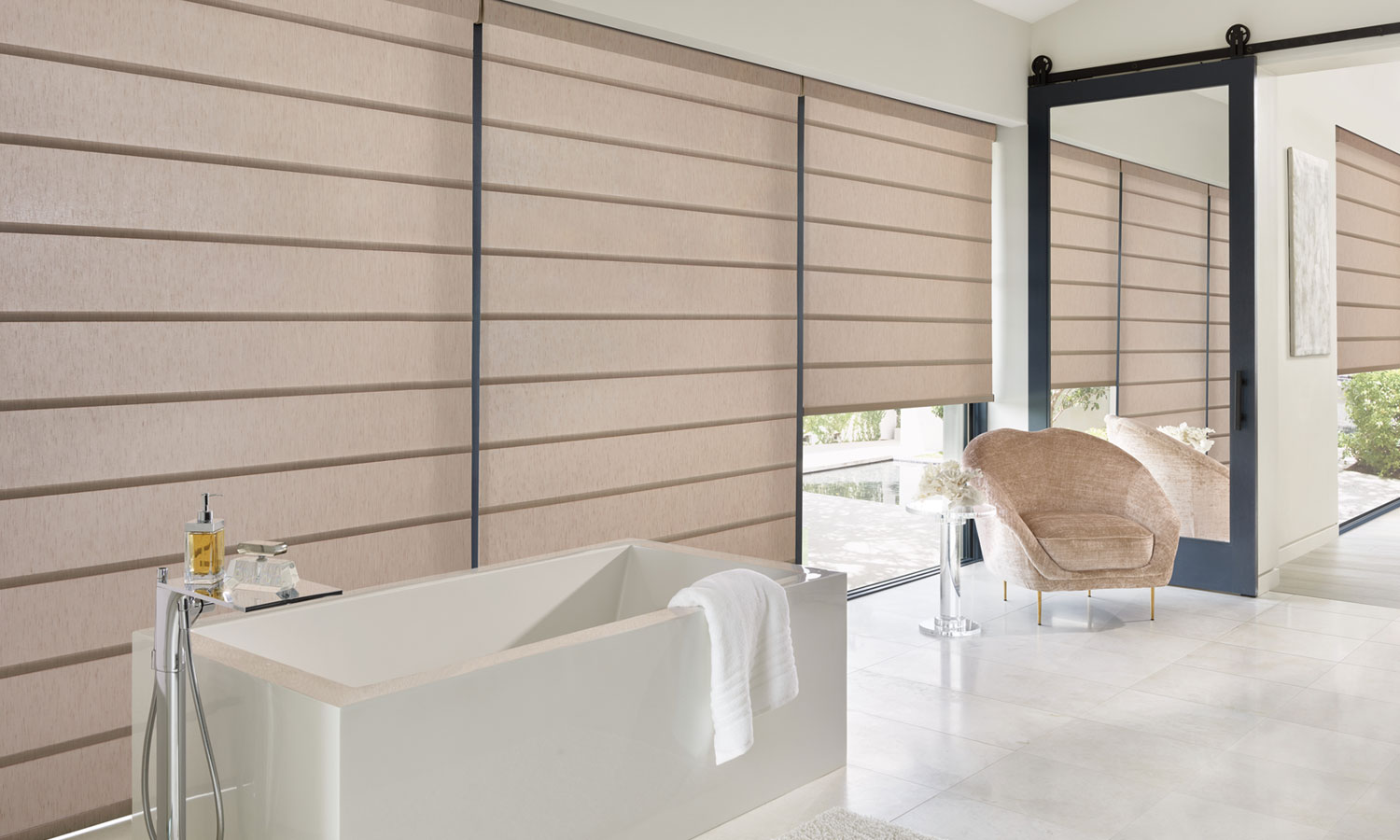 primary bathroom with roman shades on floor to ceiling windows