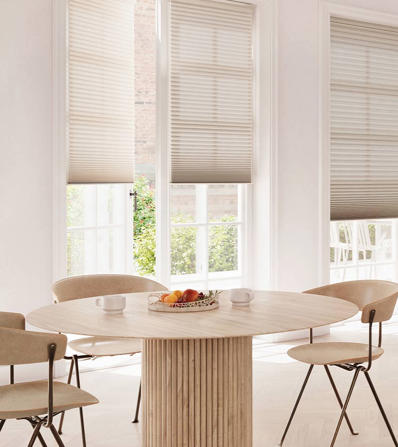 modern contemporary dining room with french glass doors covered by cellular shades