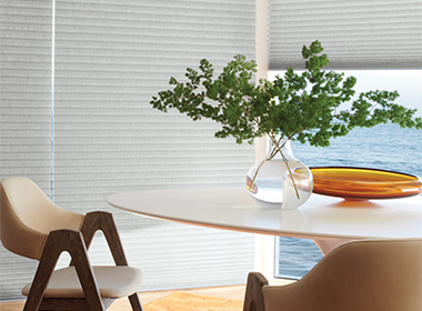gray honeycomb shades for heat control in mid century modern home