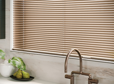 metal window blinds in kitchen with chrome and marble accents