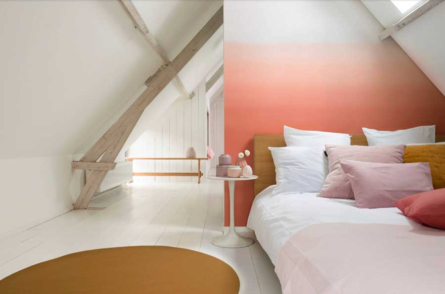 ombre peach fuzz in bedroom feature wall 