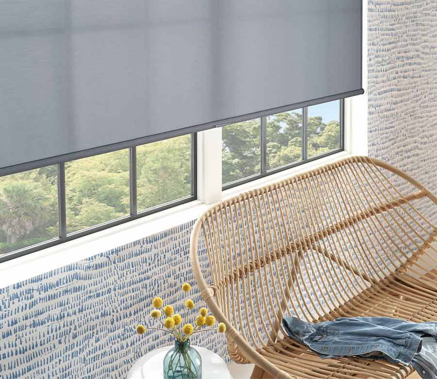 modern fabric shades patterned wallpaper and rattan chair