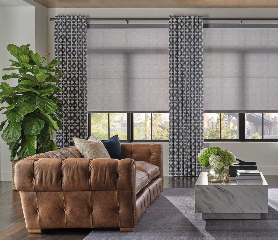 drapery and roller shades on windows in contemporary living room
