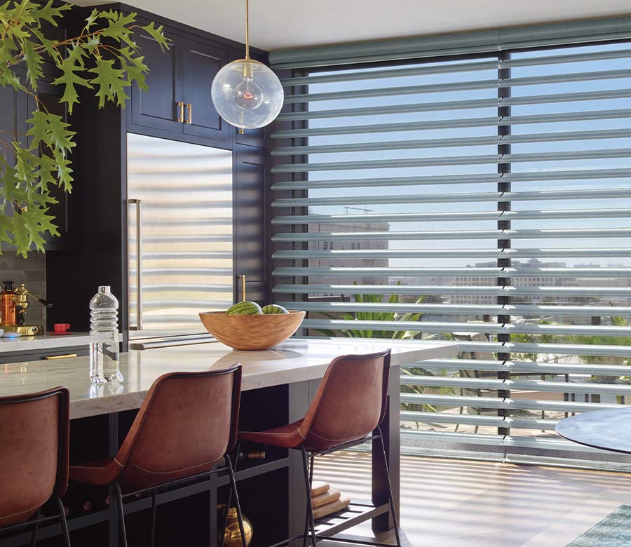 view of bar area with light coming through floor to ceiling window blinds