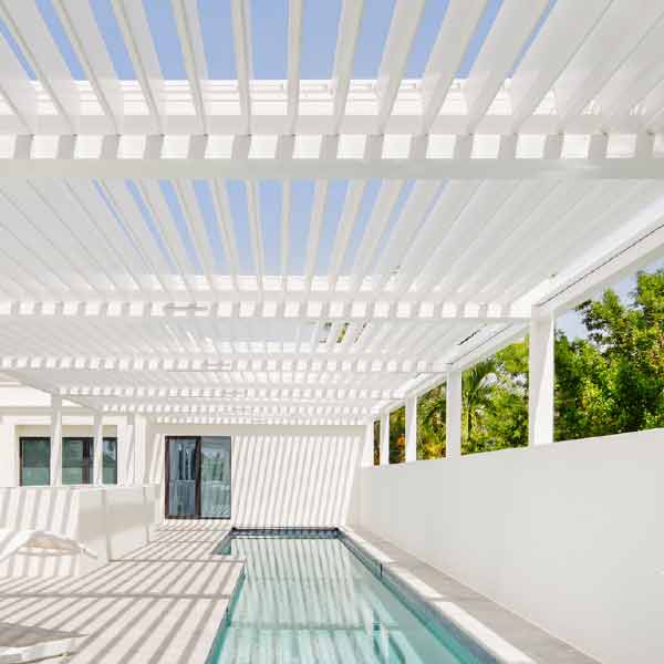 exterior-shade-louvered-roof-option-details-timan-window-treatments white pergola over outdoor lap pool
