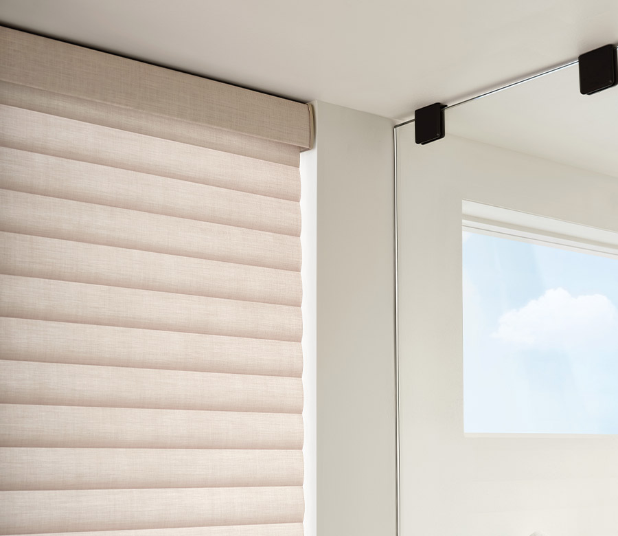 inside of walk-in shower view and floor to ceiling window covering for maximum light control and privacy